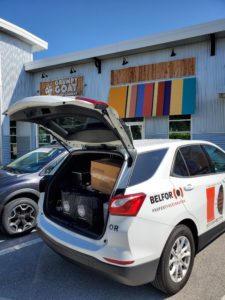 BELFOR vehicle with 45 pounds of fresh roasted coffee from Grumpy Goat Coffee roastery along with brewing equipment and coffee supplies donated by Stan’s Coffee, BELFOR and M&M Multimedia.